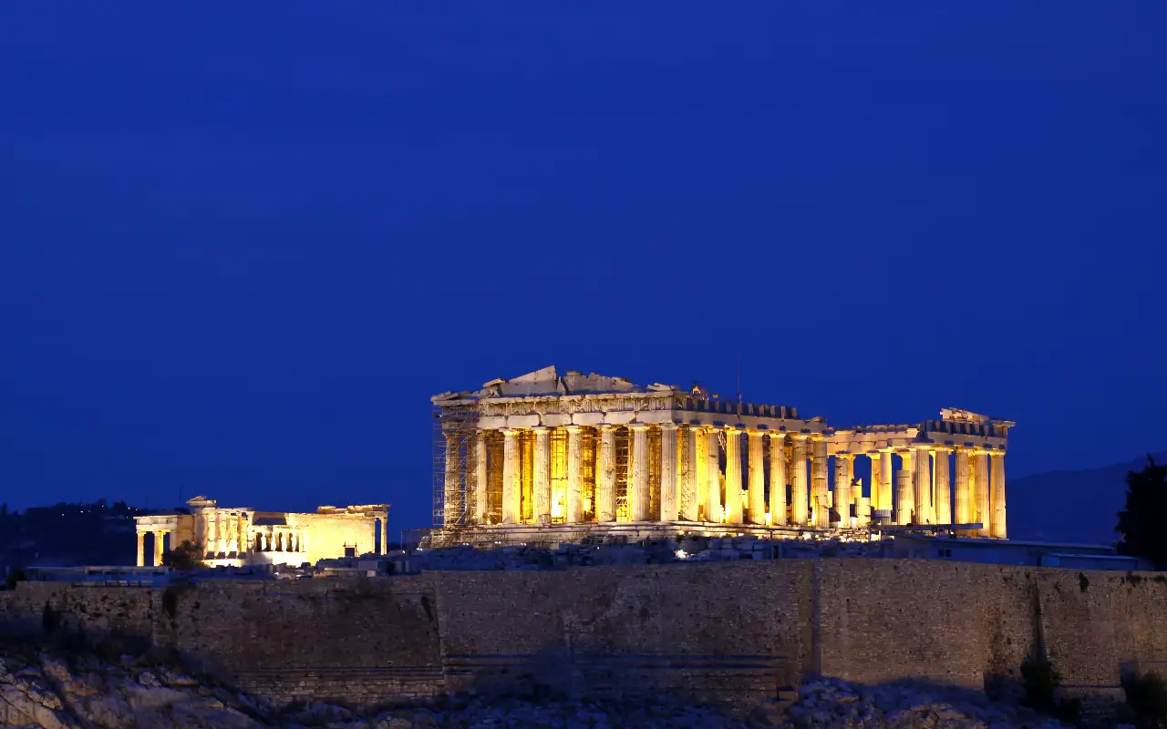 The Acropolis in Athens, Greece - a UNESCO World Heritage Site featuring ancient ruins and monuments such as the Parthenon and the Propylaea.