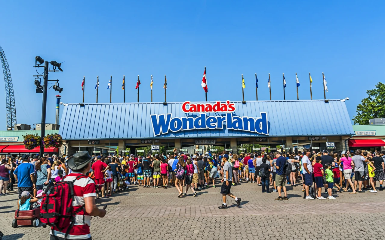 Excited visitors enjoying thrilling attractions and rollercoasters at Canada's Wonderland amusement park.