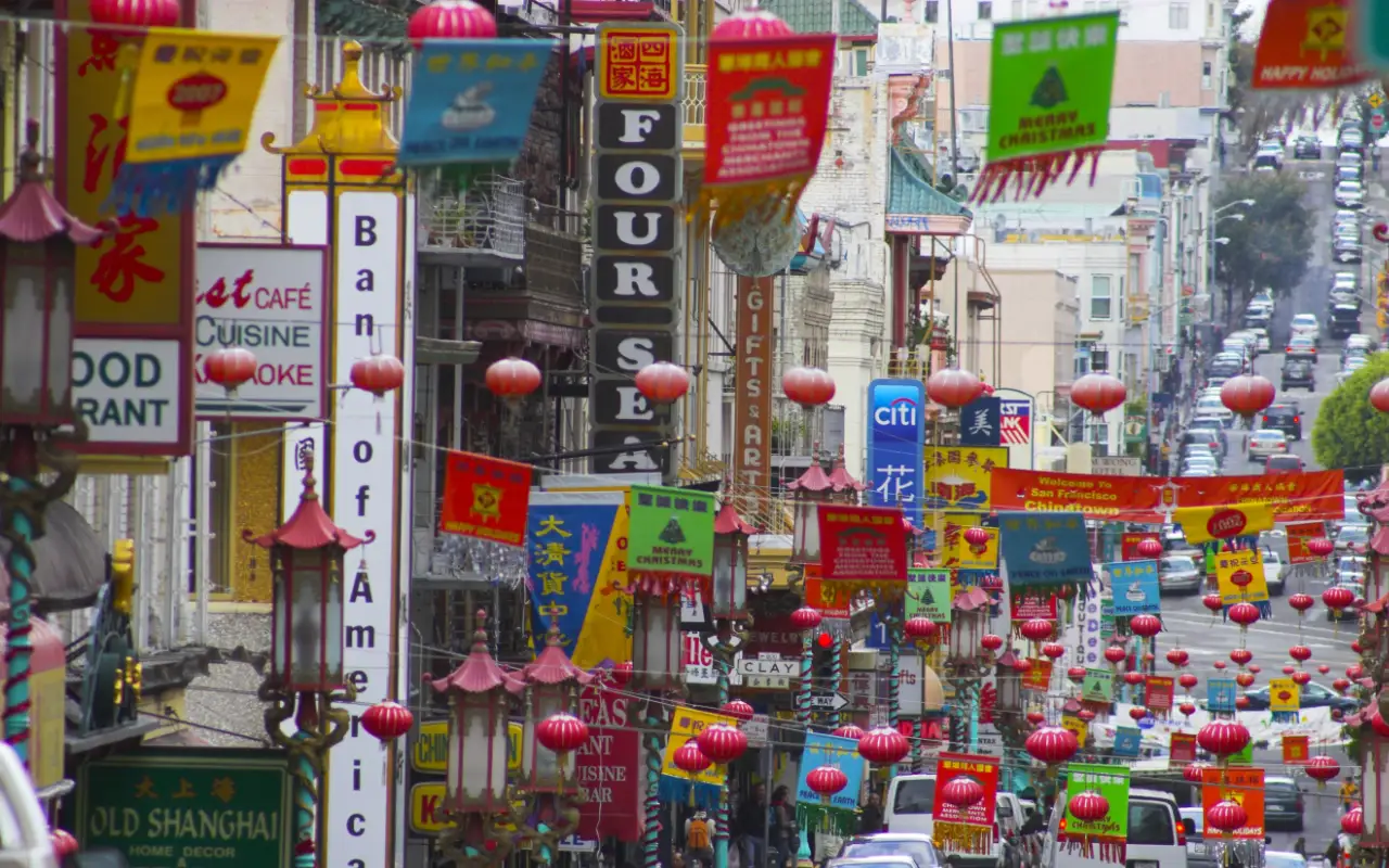 View of vibrant and colorful Chinatown in San Francisco, featuring traditional architecture and bustling streets