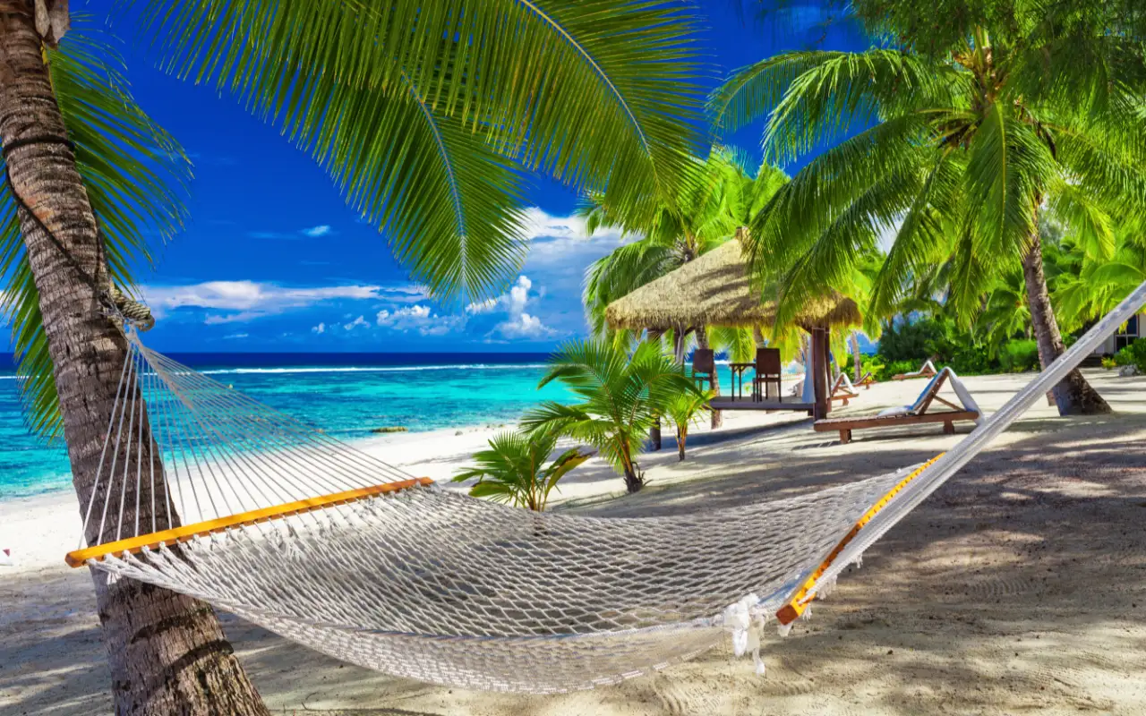 Scenic view of the Cook Islands, showing pristine beaches and lush green landscapes