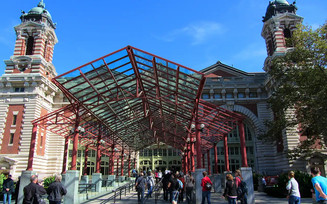 A historic photo of immigrants arriving at Ellis Island, the gateway to America for millions of people during the early 20th century