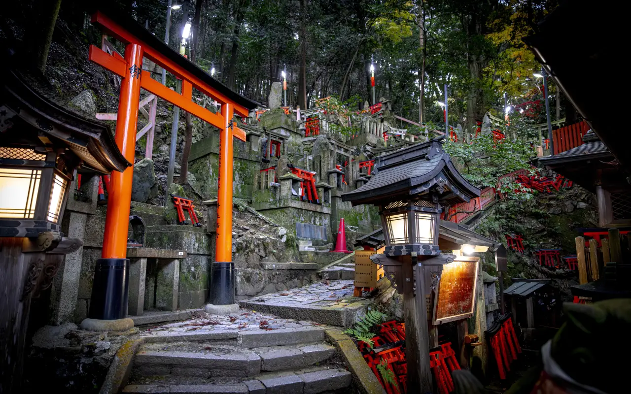 Fushimi Inari Taisha Shrine with torii gates and lanterns