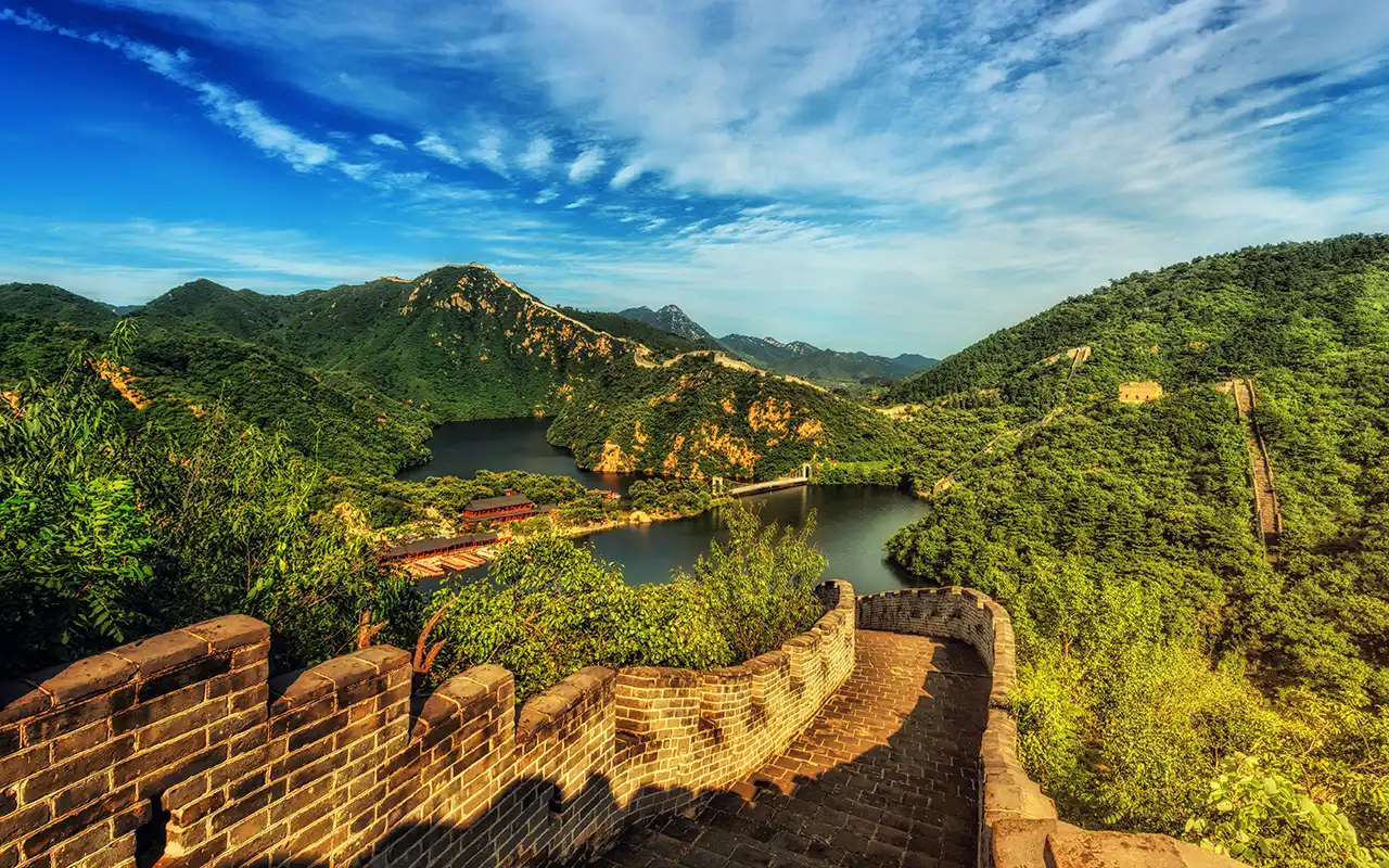 Panoramic view of the majestic Great Wall of China stretching across mountains and valleys