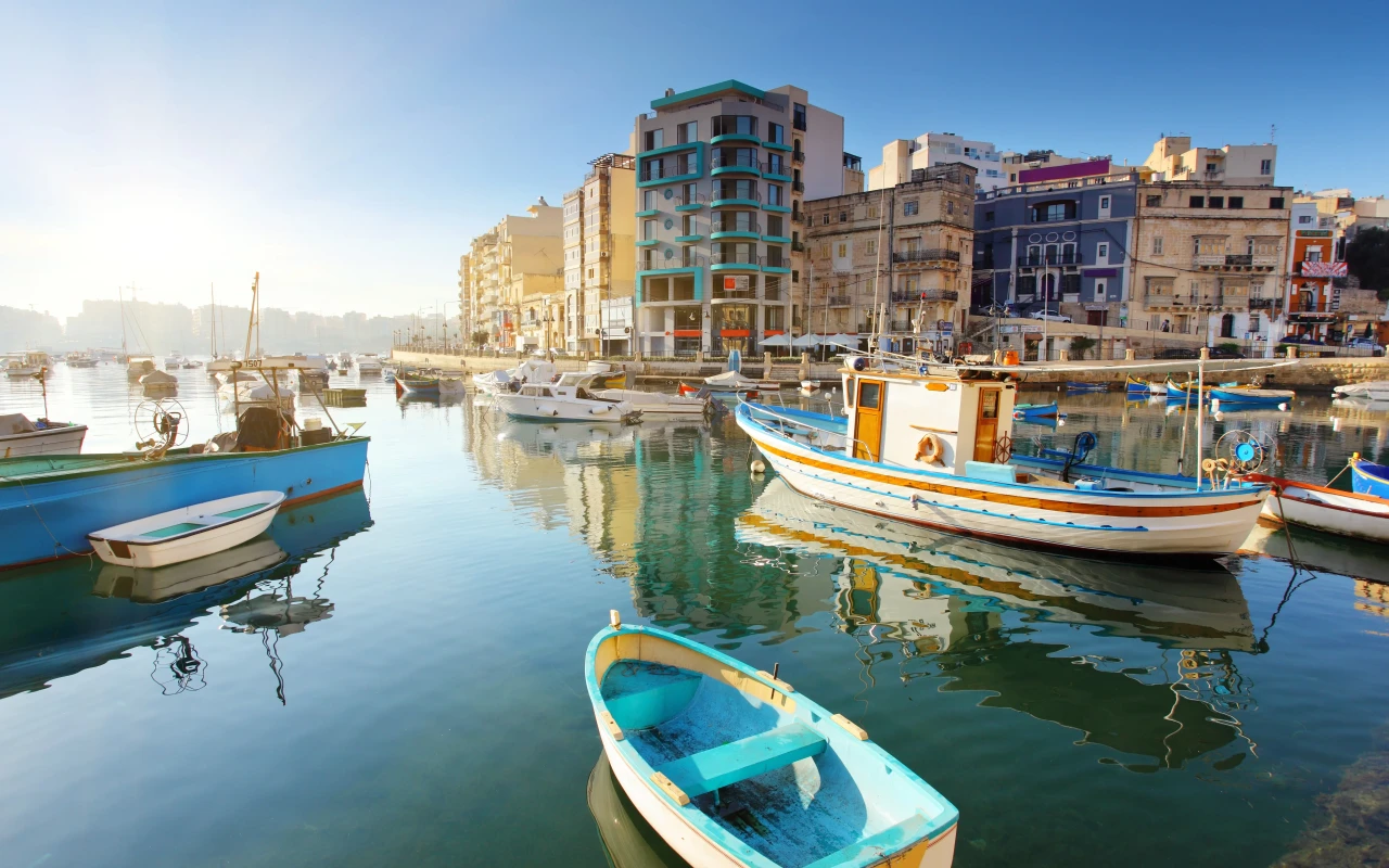 A beautiful view of Malta's stunning coastline and crystal-clear Mediterranean waters, showcasing the island's natural beauty and historical architecture