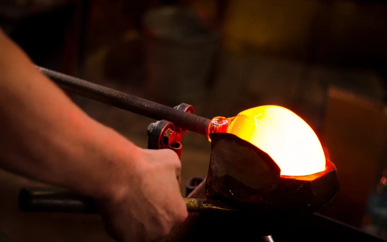 Elegant Murano glass works display featuring intricate designs and vibrant colors