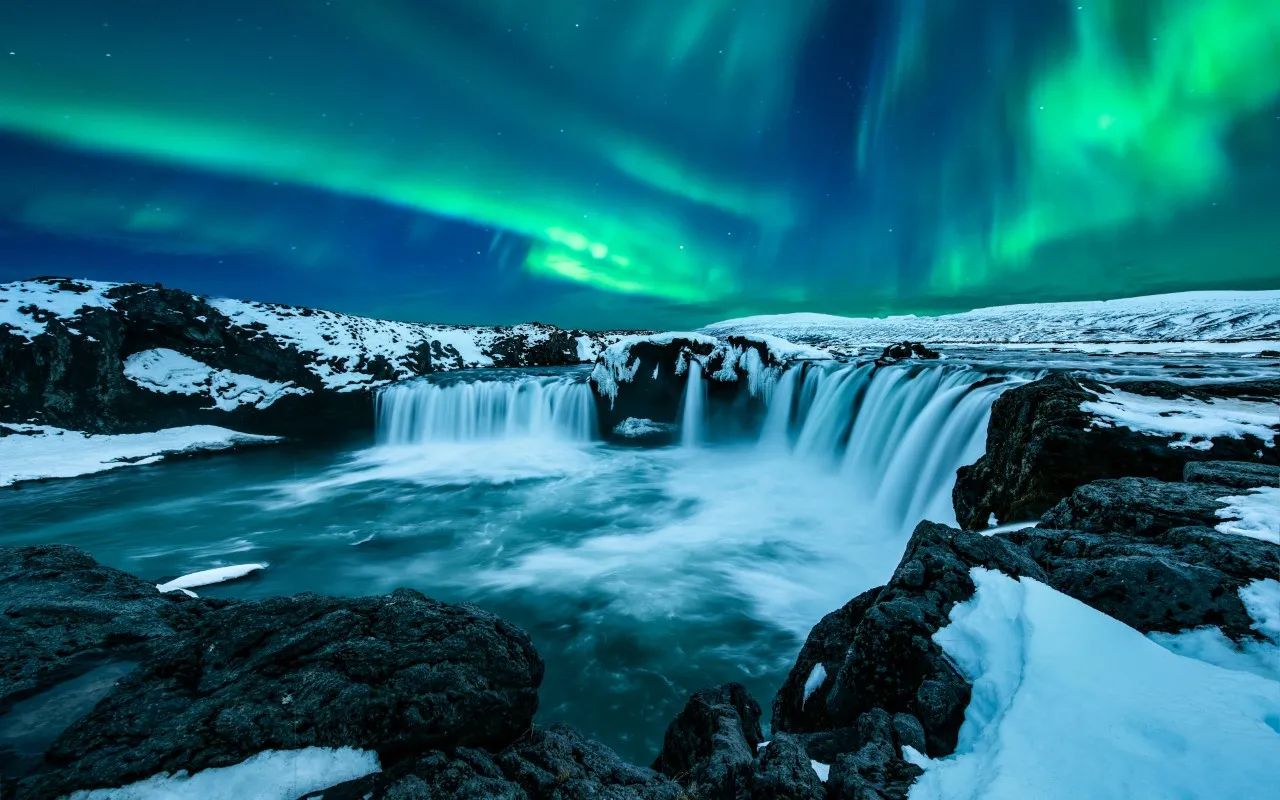 A stunning display of Iceland Northern Lights, vibrant, colorful ribbons of light dancing across the night sky.