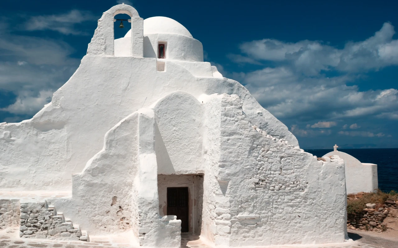 Image of the ancient Paraportiani 14th century church enveloped in clouds at Mykonos, Greece