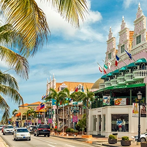 Tropical paradise in Aruba with palm trees and crystal-clear turquoise water on a white sand beach