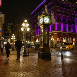 A vibrant street scene in Gastown, Vancouver, featuring historical buildings, cobblestone streets, and the iconic steam clock.
