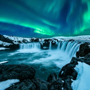 A stunning display of Iceland Northern Lights, vibrant, colorful ribbons of light dancing across the night sky.