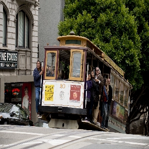 Vintage San Francisco cable cars travelling uphill