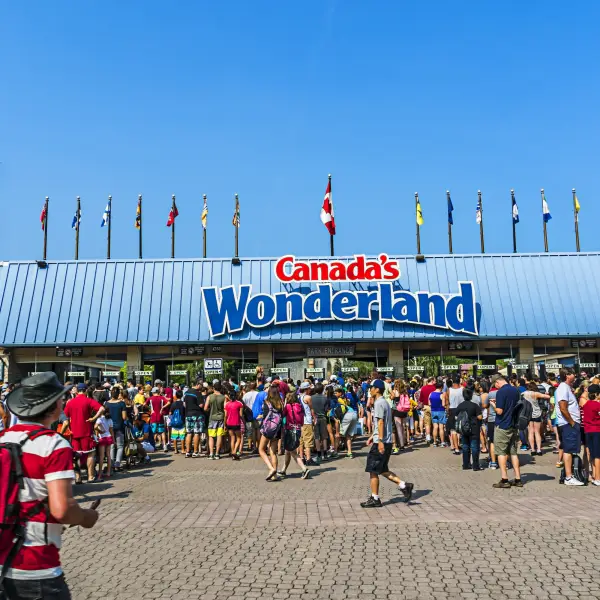 Excited visitors enjoying thrilling attractions and rollercoasters at Canada's Wonderland amusement park.