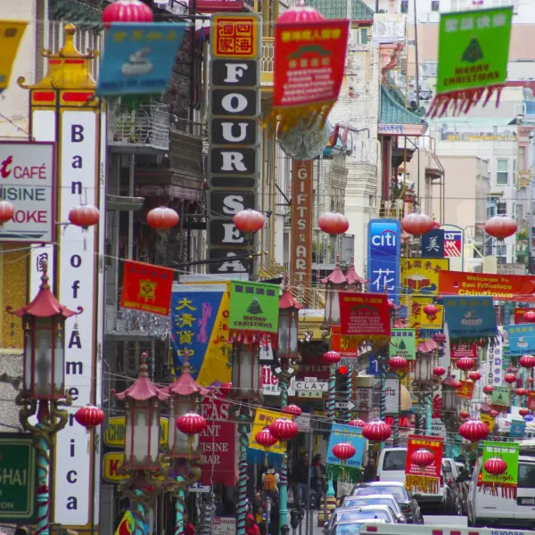 View of vibrant and colorful Chinatown in San Francisco, featuring traditional architecture and bustling streets
