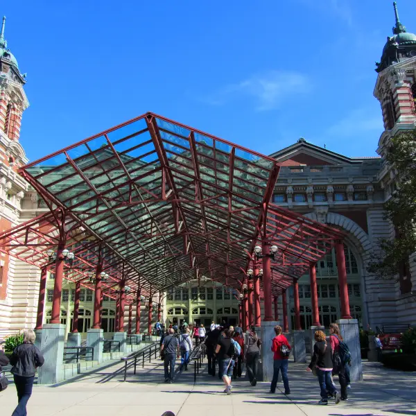 A historic photo of immigrants arriving at Ellis Island, the gateway to America for millions of people during the early 20th century