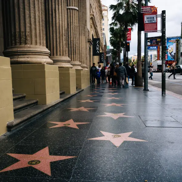 Group of tourists admiring the stars on the Hollywood Walk of Fame