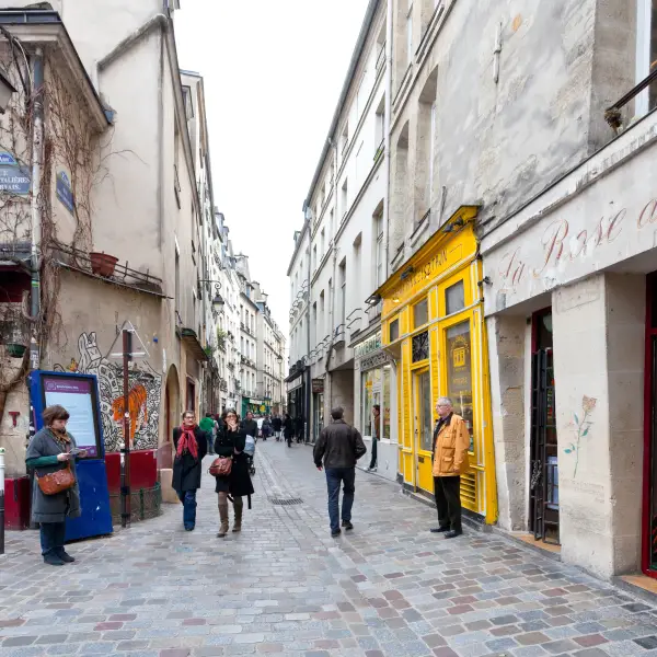 A picturesque view of the historic Le Marais district, with its charming narrow streets, trendy shops, and beautiful architecture in Paris, France.
