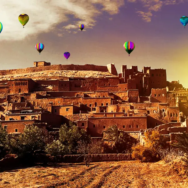 A group of excited balloon riders enjoying a breathtaking view of Marrakesh, Morocco from above