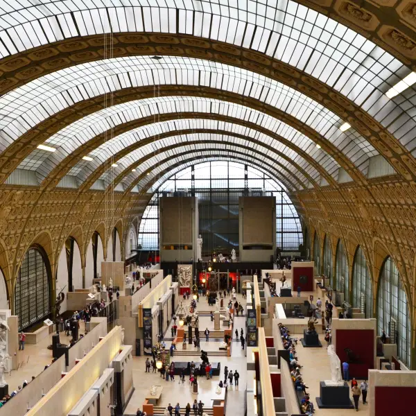 Inside the Musee d'Orsay, a stunning art museum housed in a historic train station in Paris, showcasing Impressionist and Post-Impressionist masterpieces.