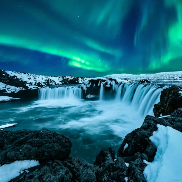 A stunning display of Iceland Northern Lights, vibrant, colorful ribbons of light dancing across the night sky.