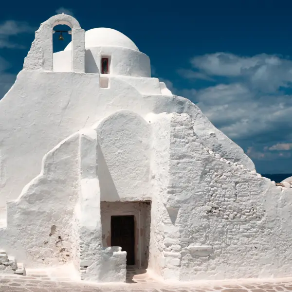 Image of the ancient Paraportiani 14th century church enveloped in clouds at Mykonos, Greece
