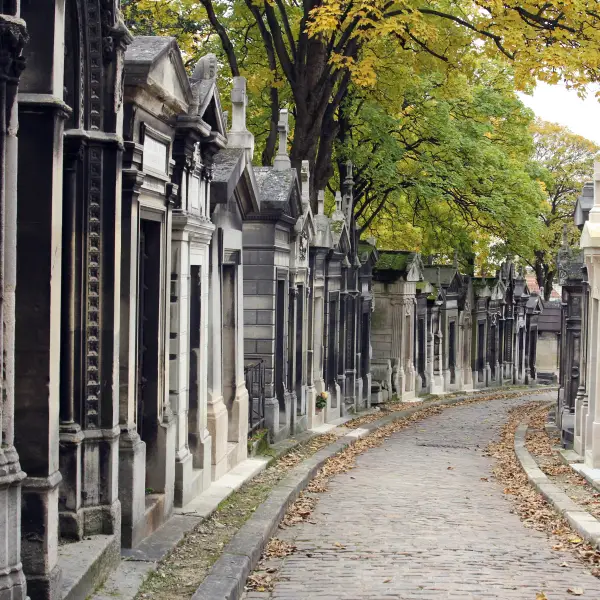 A peaceful path winding through Pere Lachaise Cemetery
