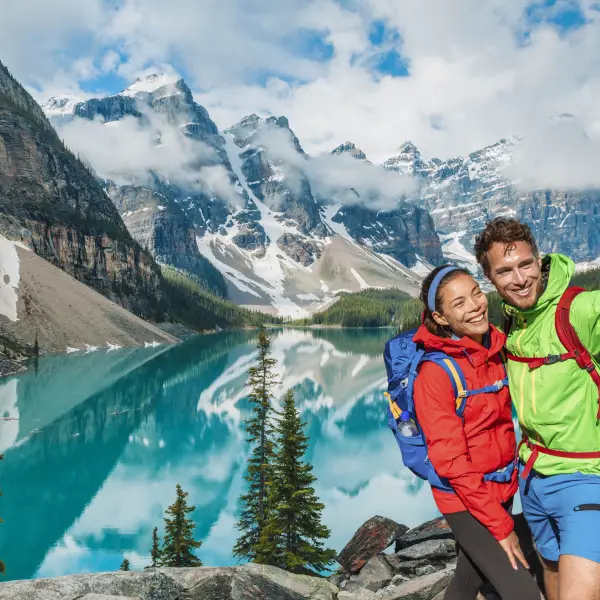 Couple enjoying a romantic boat ride on Lake Louise in Banff, Canada