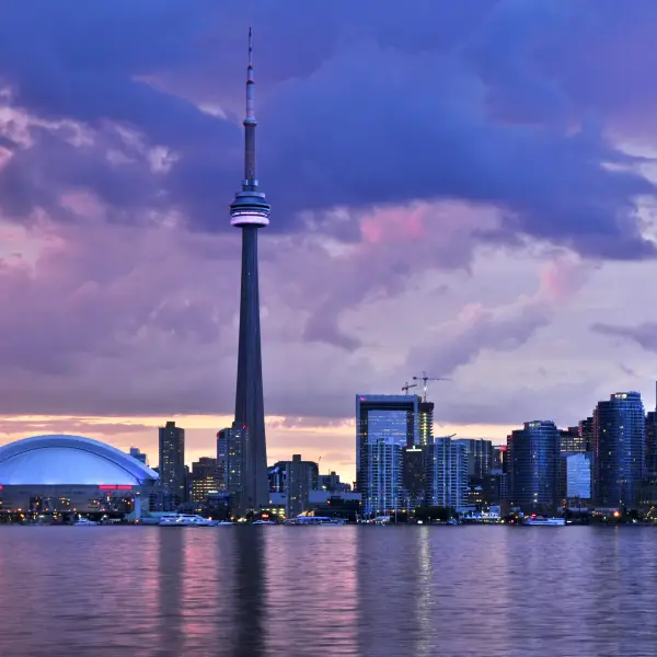 Toronto skyline with CN Tower and waterfront during sunset